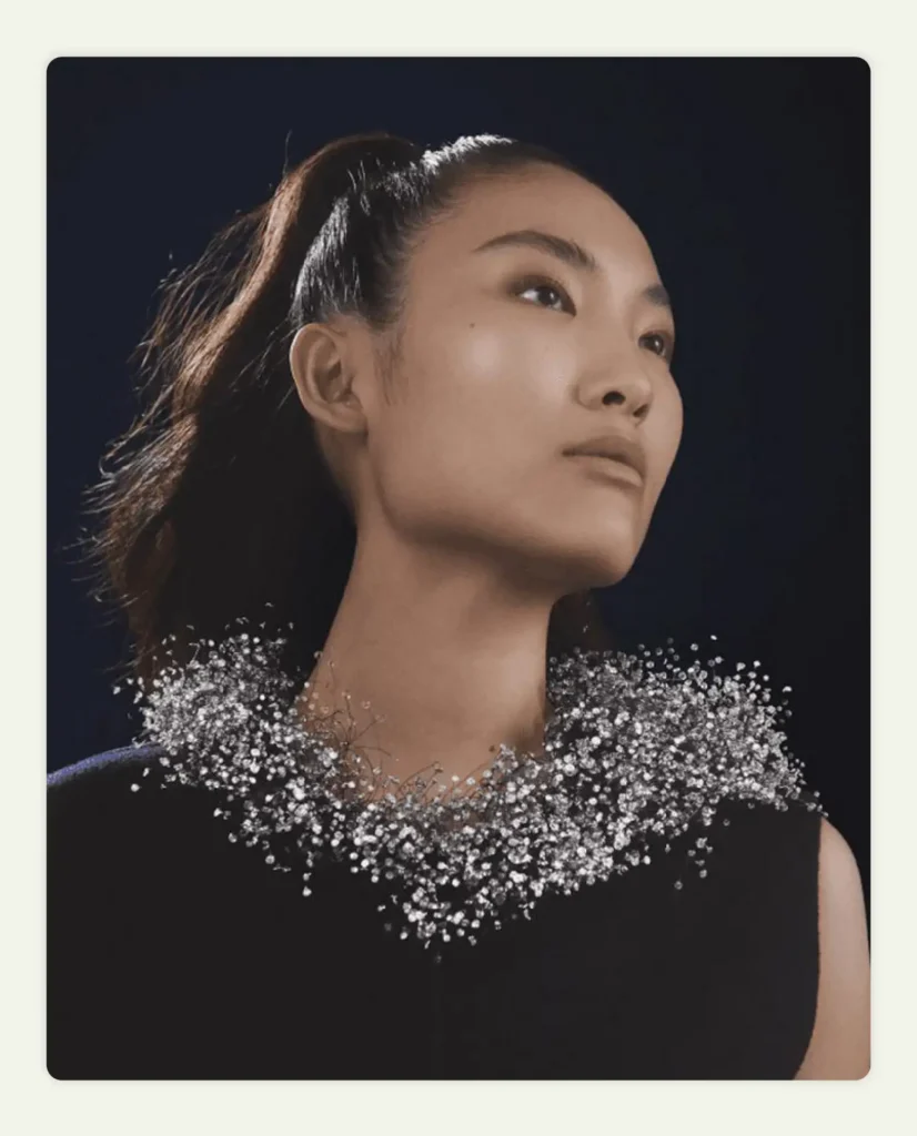 Model wearing intricate silver wire necklace resembling clouds Model wearing intricate silver wire necklace resembling clouds